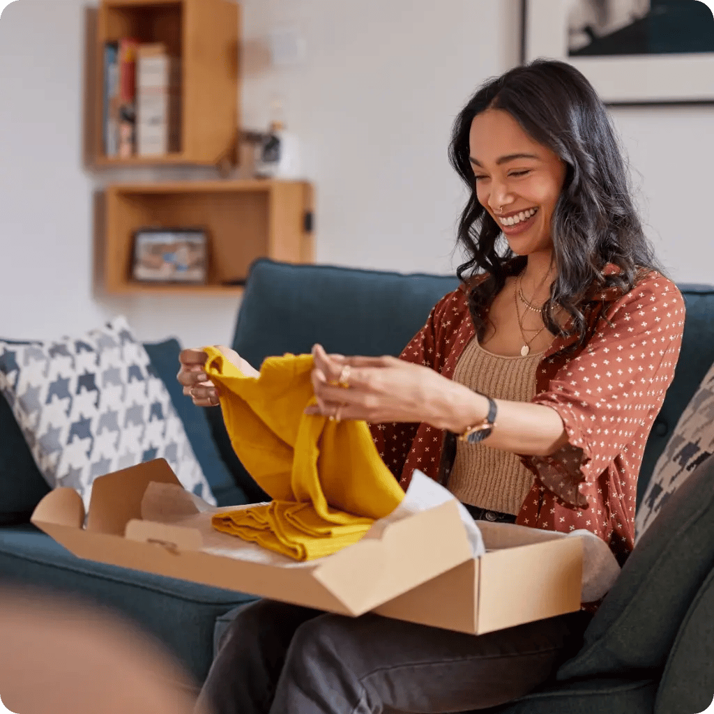 woman opening subscription box delivery