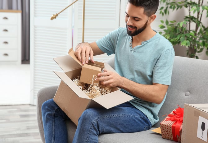 Man unboxing a delivery